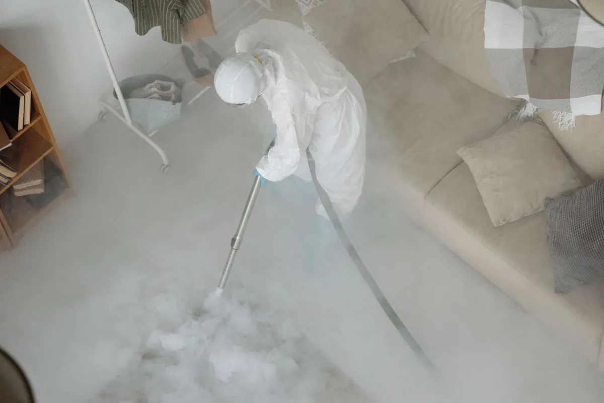 Biohazard cleanup technician in protective equipment, Oswego, NY